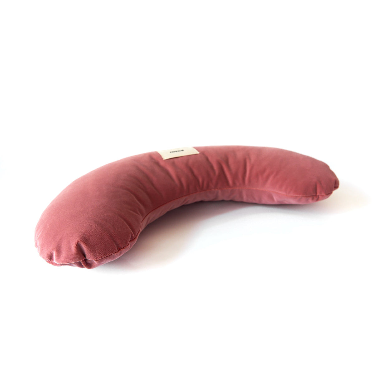 Pink curved pillow on a white background