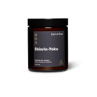 Dark jar scented soy wax candle with lid and label reading Earl of East Shinrin-Yoku