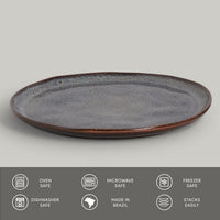 Ceramic plate with speckled design on a gray background