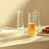 Set of 4 Pebbled Stemless Flute Glasses on a white surface