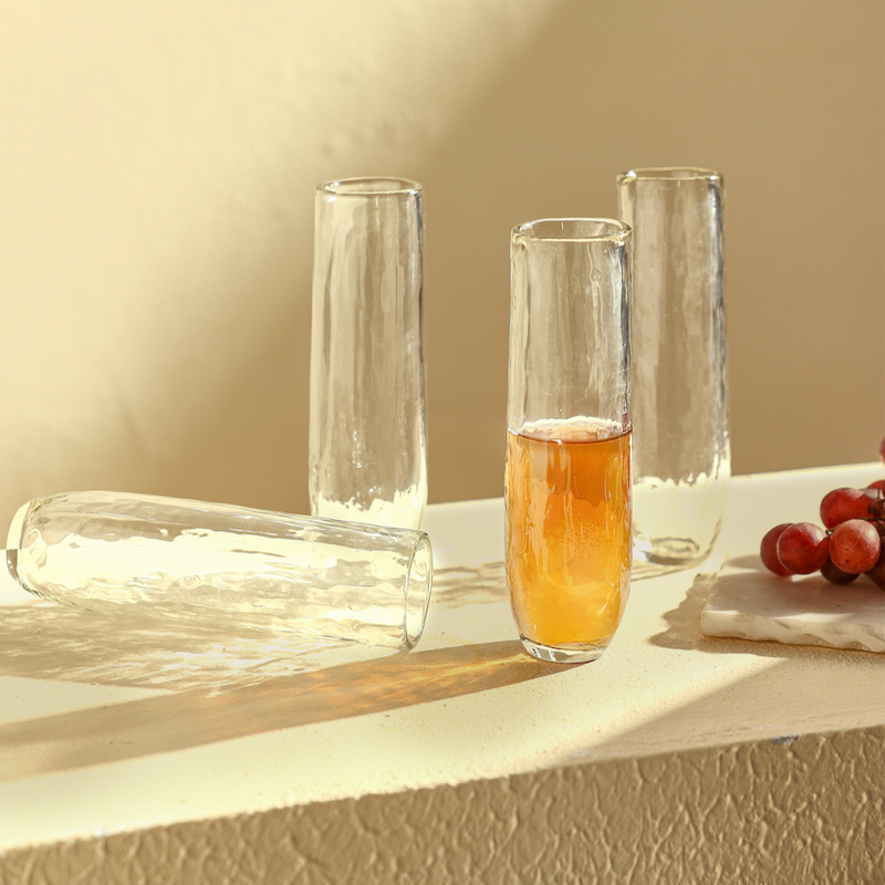 Set of 4 Pebbled Stemless Flute Glasses on a white surface