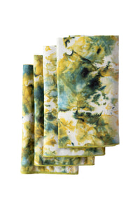 Set of tie-dye napkins with yellow, green, and white pattern on a white background