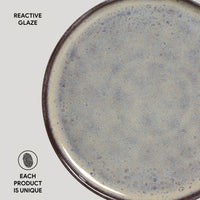 Ceramic plate with reactive glaze on a white background