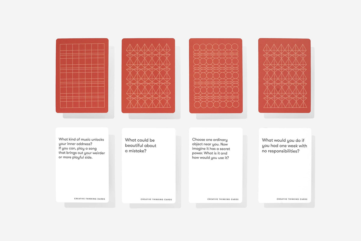 Four red card designs with geometric patterns on a white background