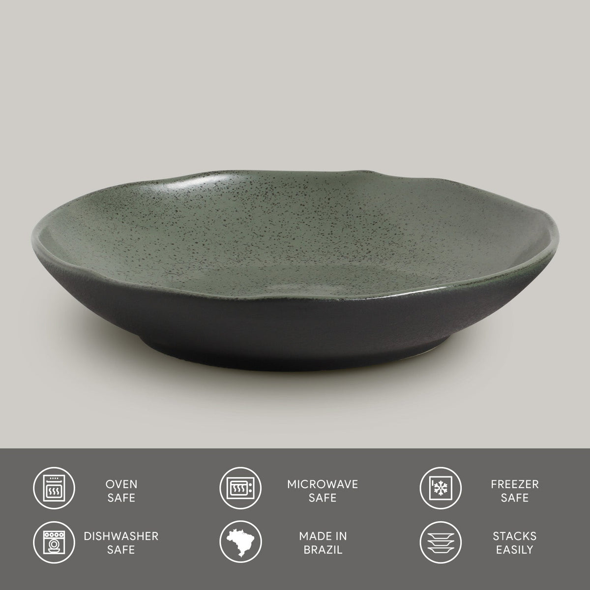 Green ceramic pasta plate on a gray background with safety and feature icons at the bottom.