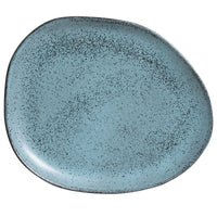 Blue ceramic plate with speckled texture on a white background