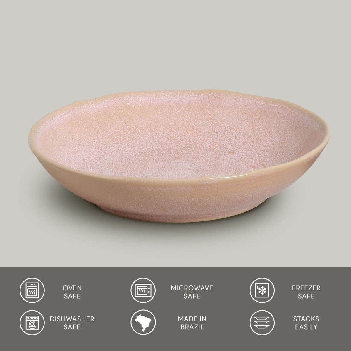 Pink ceramic pasta plate on a gray background with safety and feature icons at the bottom.