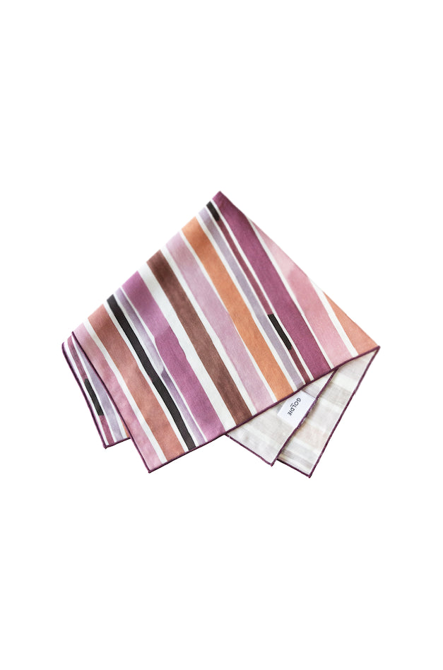 Striped napkin with pink, brown, and white colors on a white background