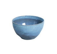 Blue ceramic bowl on a white background
