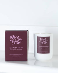 Candle and packaging of Electric Tides Crimson Shrub on a white background
