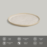 Round ceramic plate with beige rim on a gray background, featuring safety and origin icons.