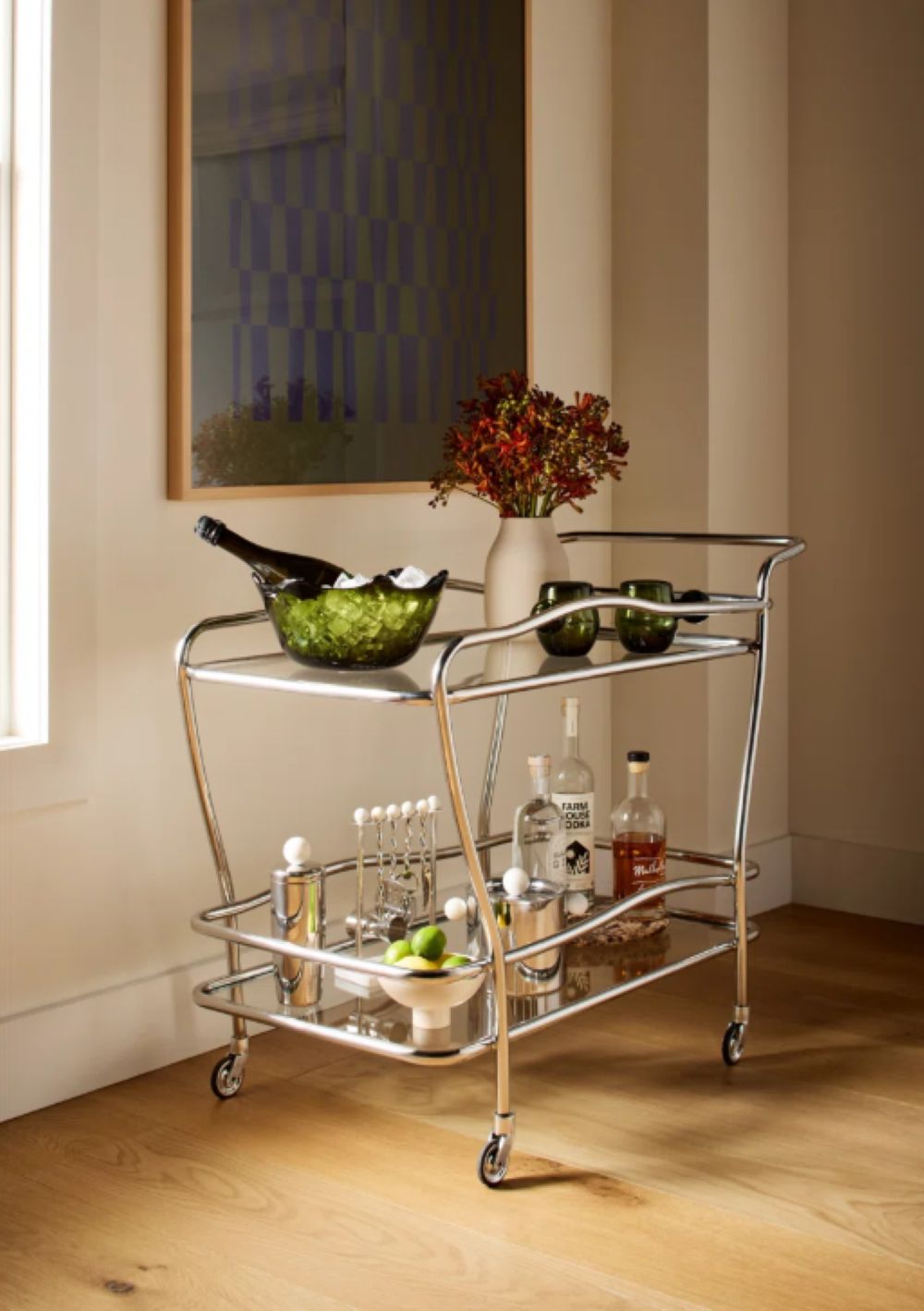 Serveware on a metal and glass bar cart