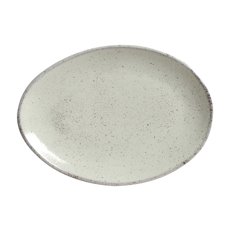 Oval ceramic plate with a speckled pattern on a white background