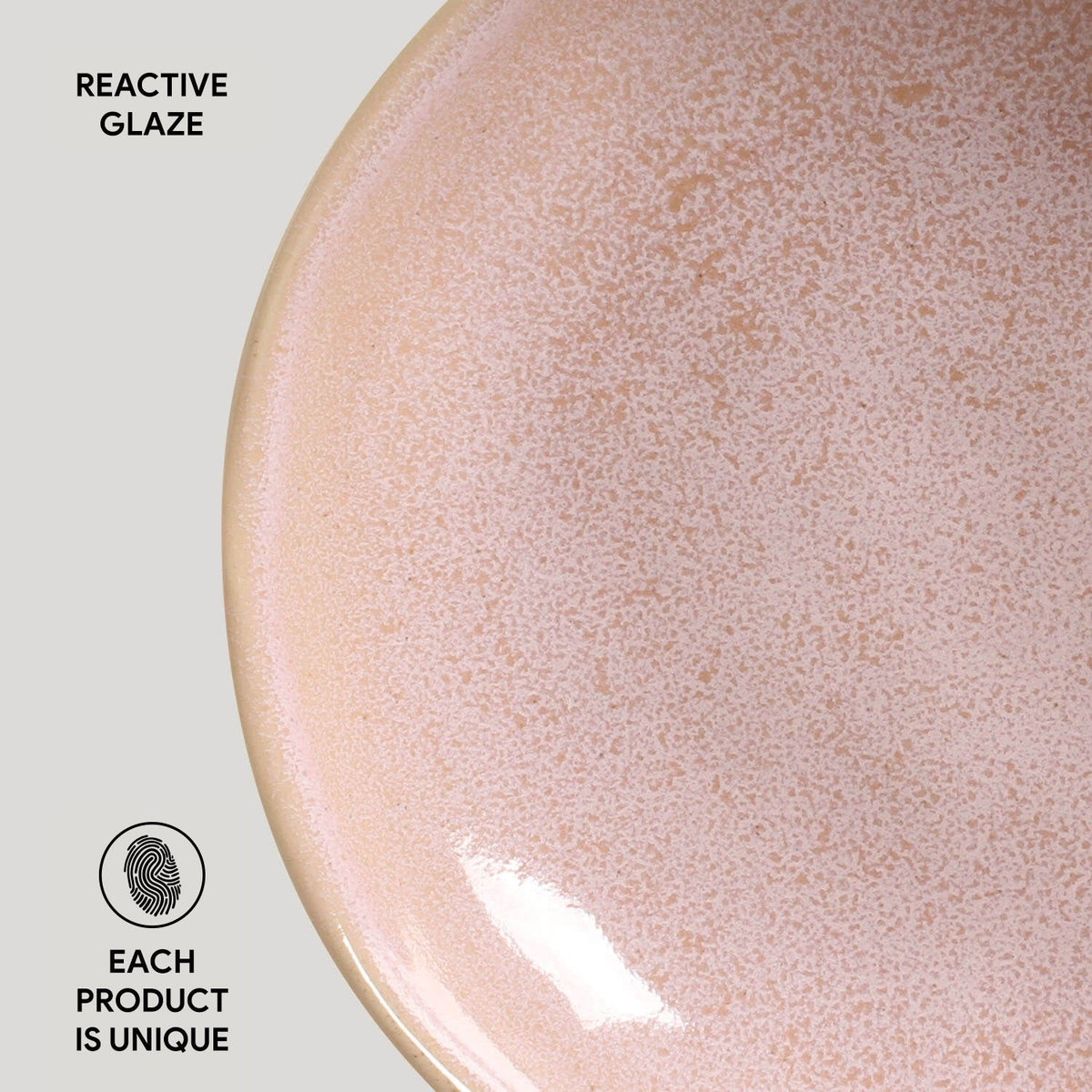 Close-up of a ceramic plate with reactive glaze texture on a light gray background.