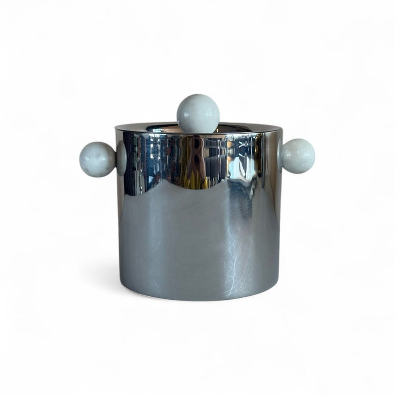 stainless steel ice bucket with marble sphere handle accents on a white background