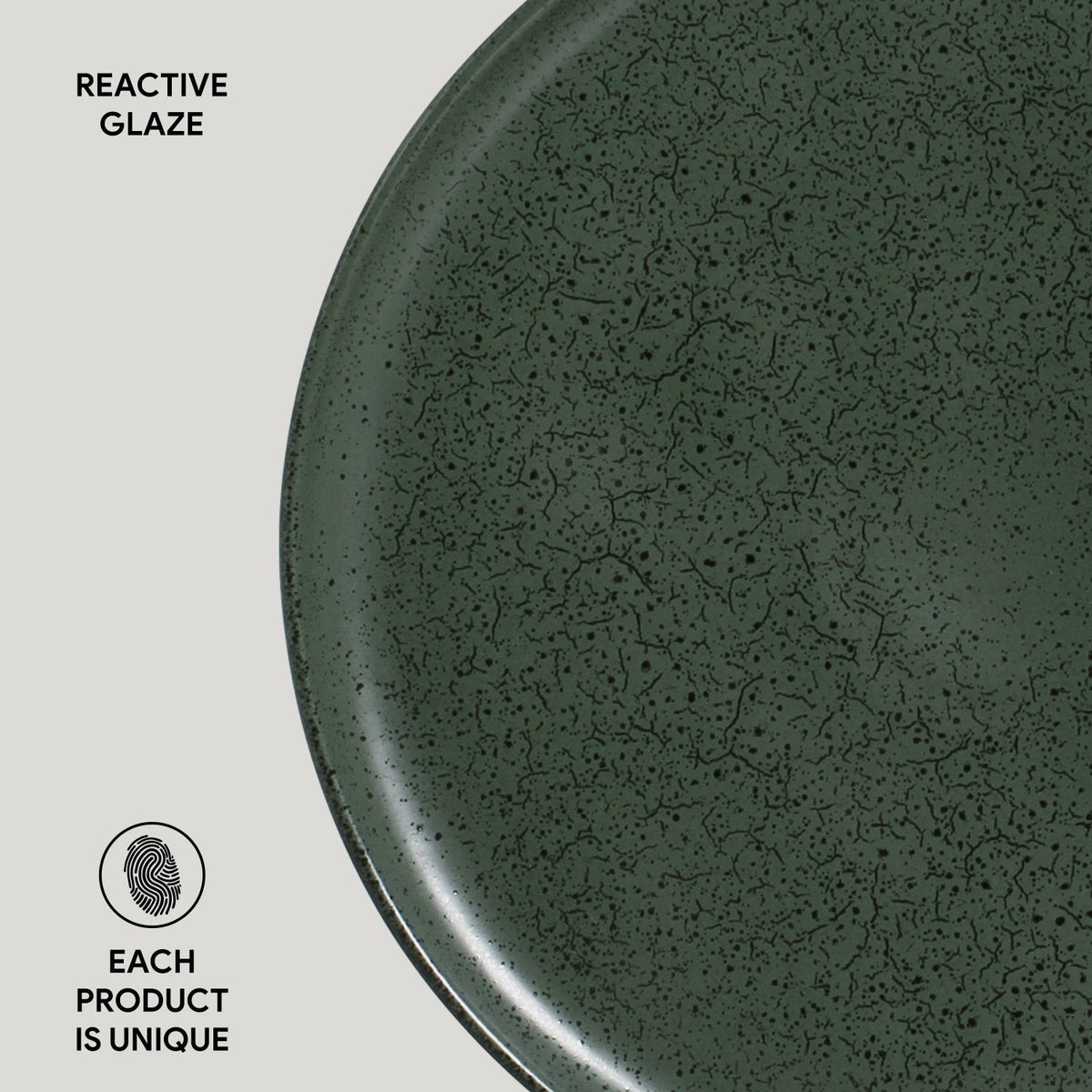 Green ceramic plate with reactive glaze texture on a light gray background