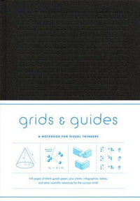 Black hard cover notebook with grid lines on cover and text about 'grids & guides' 