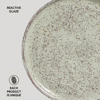 Ceramic plate with reactive glaze on a white background