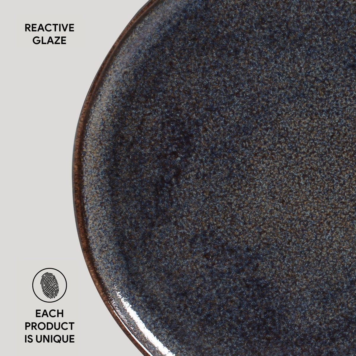 Close-up of a ceramic plate with reactive glaze on a white background