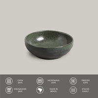 Green ceramic bowl on a gray background with safety and feature icons at the bottom.
