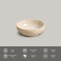Beige ceramic bowl on a gray background with safety and feature icons at the bottom.