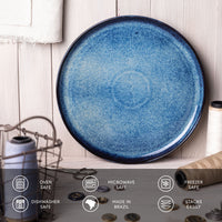 Blue ceramic plate on a wooden surface with safety and feature icons at the bottom.