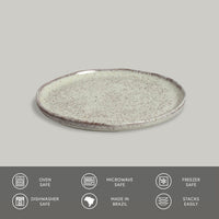 Speckled ceramic plate on a gray background with safety and feature icons below.