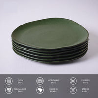 Set of green ceramic plates stacked on a white background with safety and feature icons at the bottom.