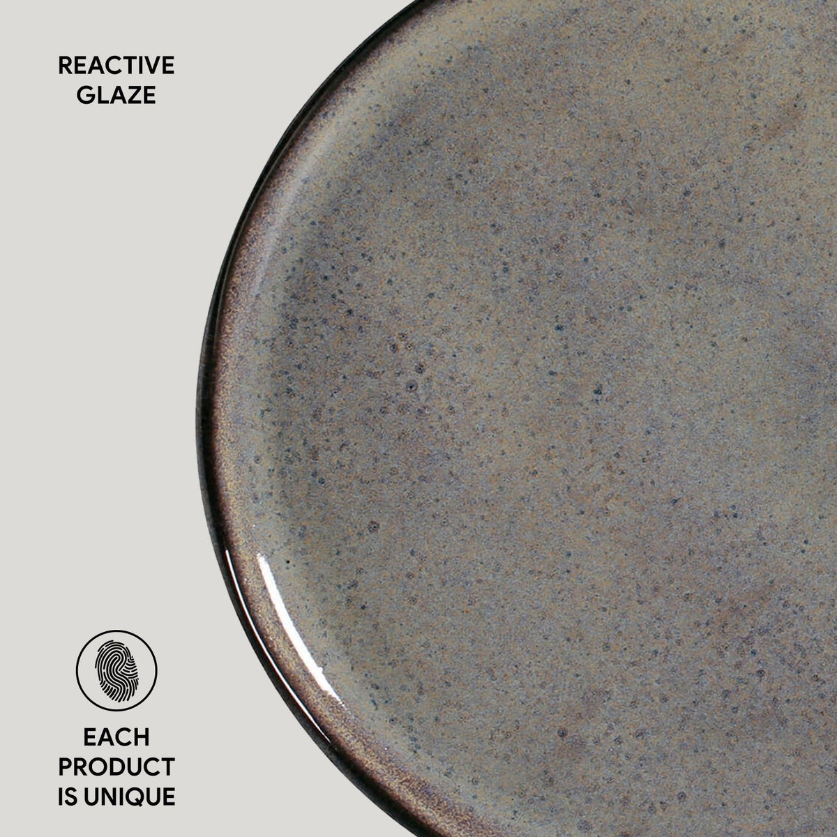 Close-up of a ceramic plate with reactive glaze on a light gray background