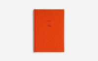 Orange notebook with minimal design and 'Ideas' title on a white background
