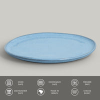 Blue ceramic plate on a gray background with safety and feature icons at the bottom.