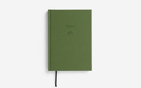 Green notebook with 'Journeys' title on a white background 
