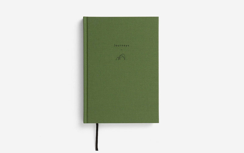 Green notebook with 'Journeys' title on a white background 