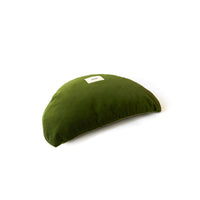 Green cushion with a label on a white background