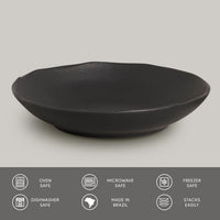 Black ceramic pasta plate on a light gray background with safety and feature icons at the bottom.