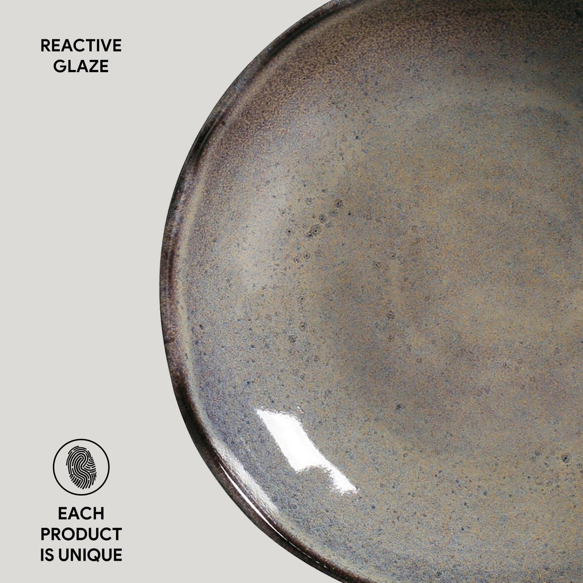 Ceramic plate with reactive glaze on a light gray background