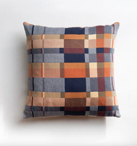 Checkered pillow with multicolor pattern on a white background