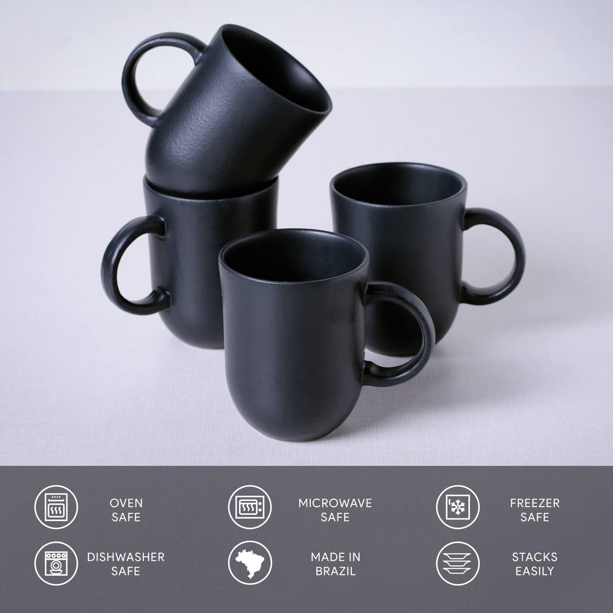 Set of black mugs on a light gray background with safety and feature icons at the bottom.