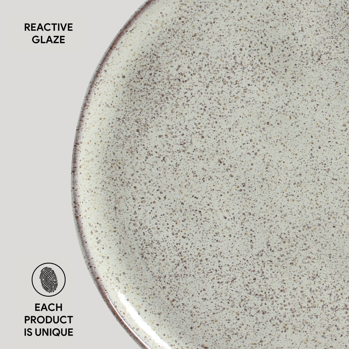 Close-up of a ceramic plate with reactive glaze texture on a white background