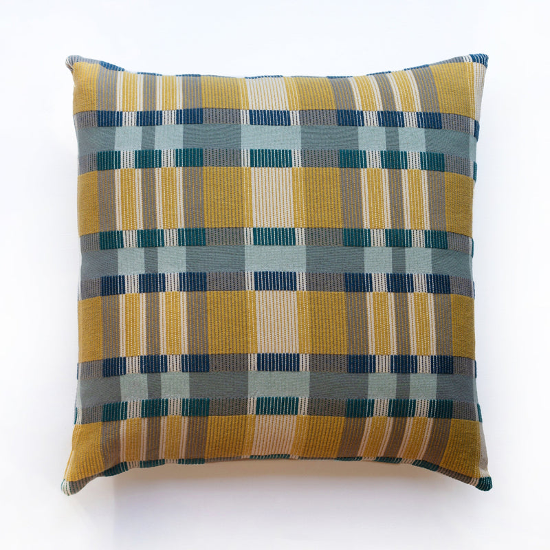 Plaid patterned pillow with yellow and blue colors on a white background