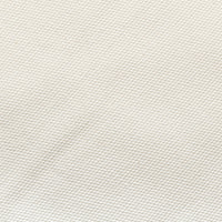 Close-up of a textured white fabric surface