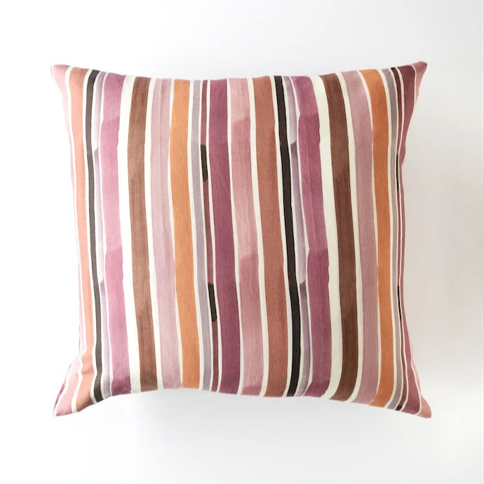 Striped pillow with multicolor pattern on a white background