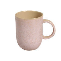 Speckled pink mug with a beige interior on a white background