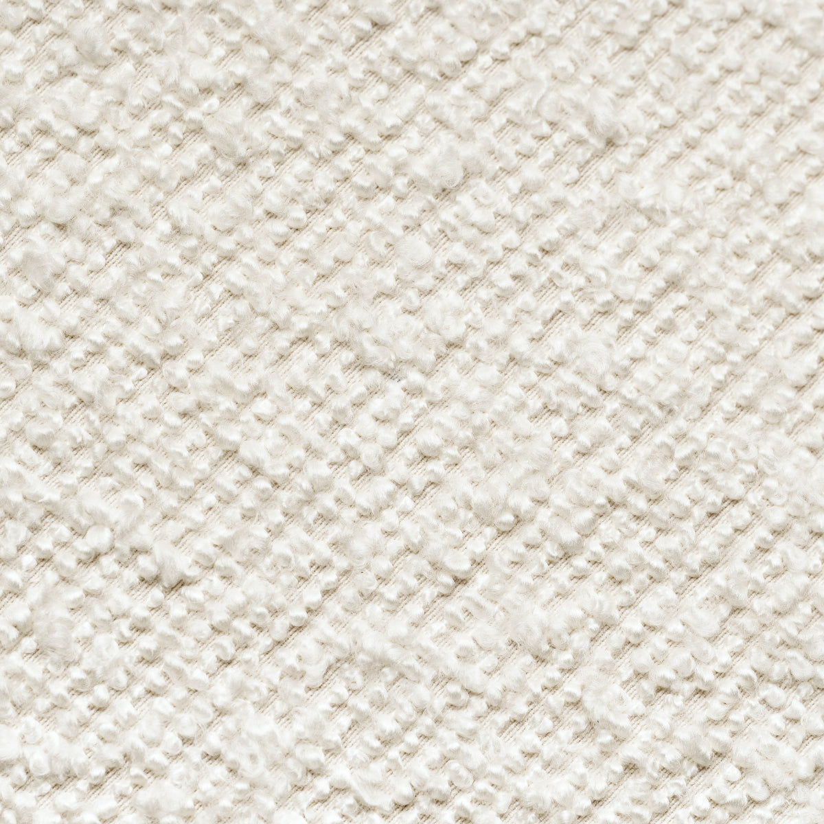 Close-up of a textured beige fabric with a subtle pattern