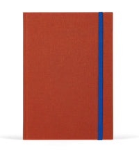 Red notebook with a blue strap on a white background