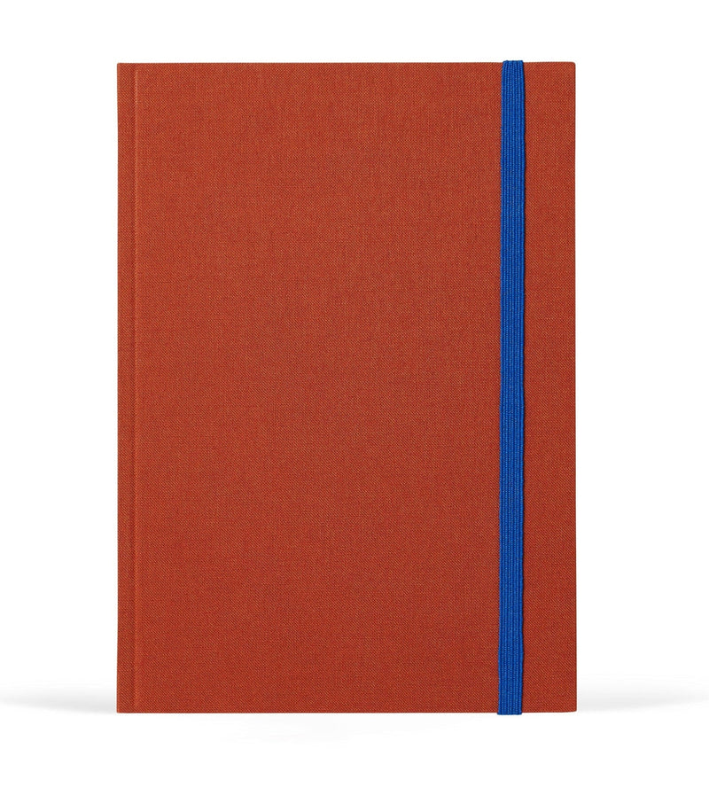 Red notebook with a blue strap on a white background