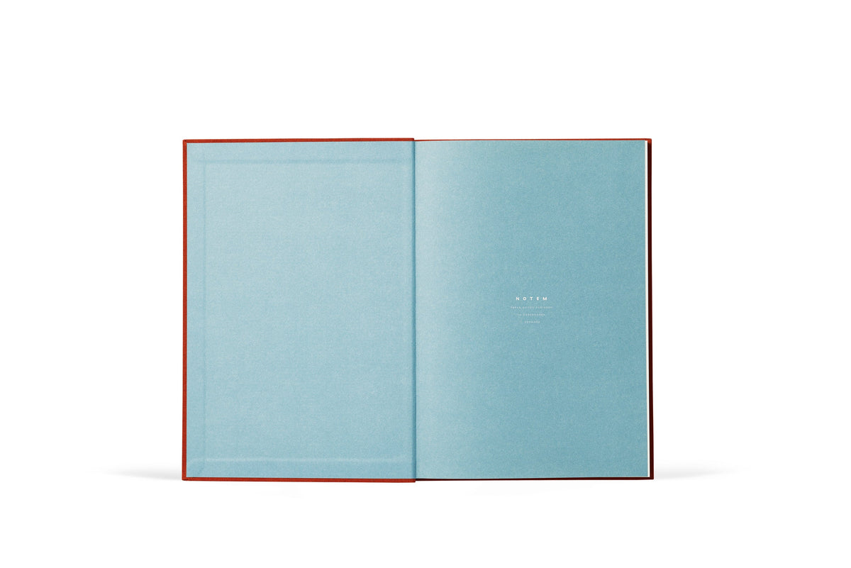 Open book with light blue pages on a white background