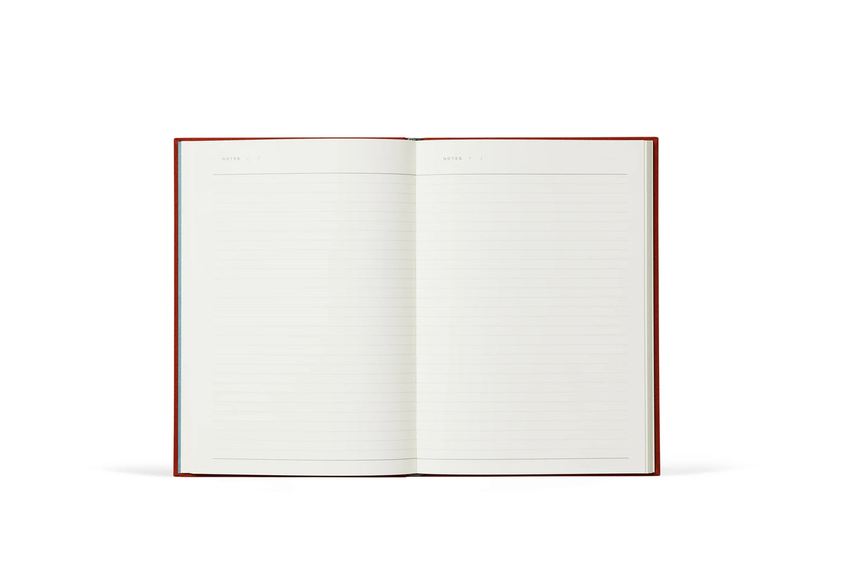 Open notebook with lined pages on a white background