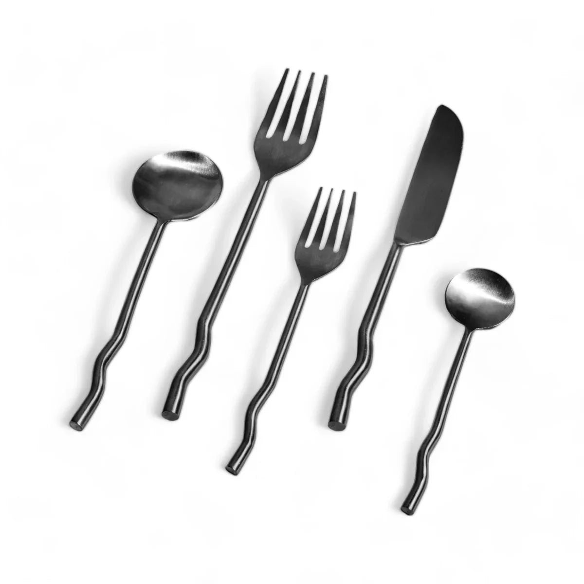 Set of silver cutlery including spoon, fork, and knife on a white background