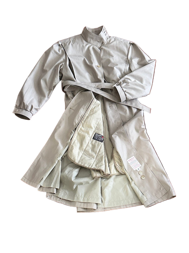 Beige trench coat on a white background